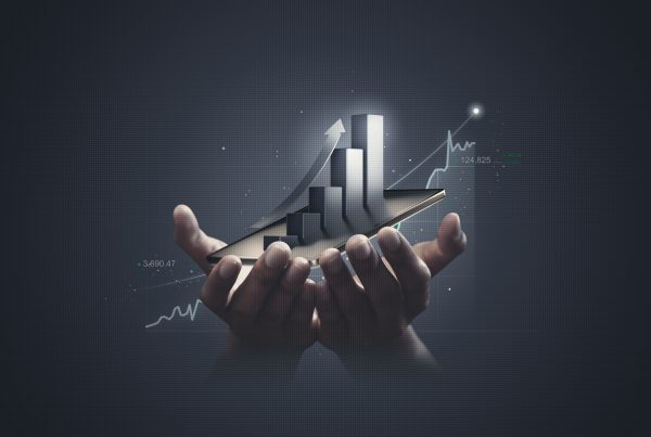 Businessman holding stock tablet and market economy graph statistic showing growth of profit analyzing financial exchange on increase digital money background with trade chart finance data concept illustrating small business growth hacks