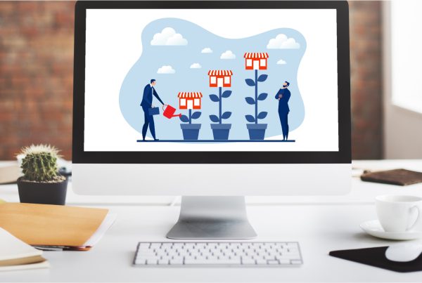 desktop computer with image on screen representing small business website creating growth