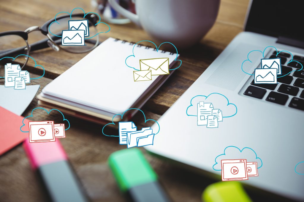 Composite image of business desk with laptop, coffee, and bloc note